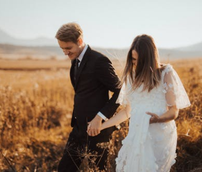 Couple walking in a field